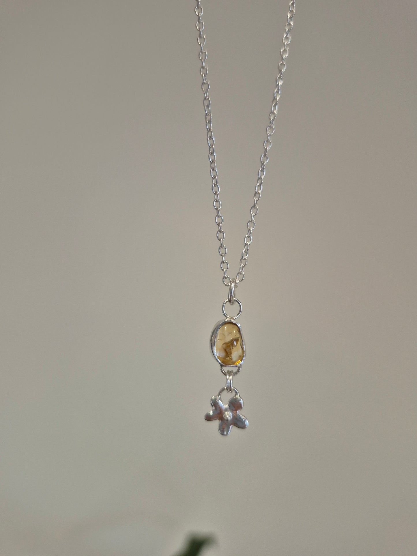 Necklace with a pendant on a plain background