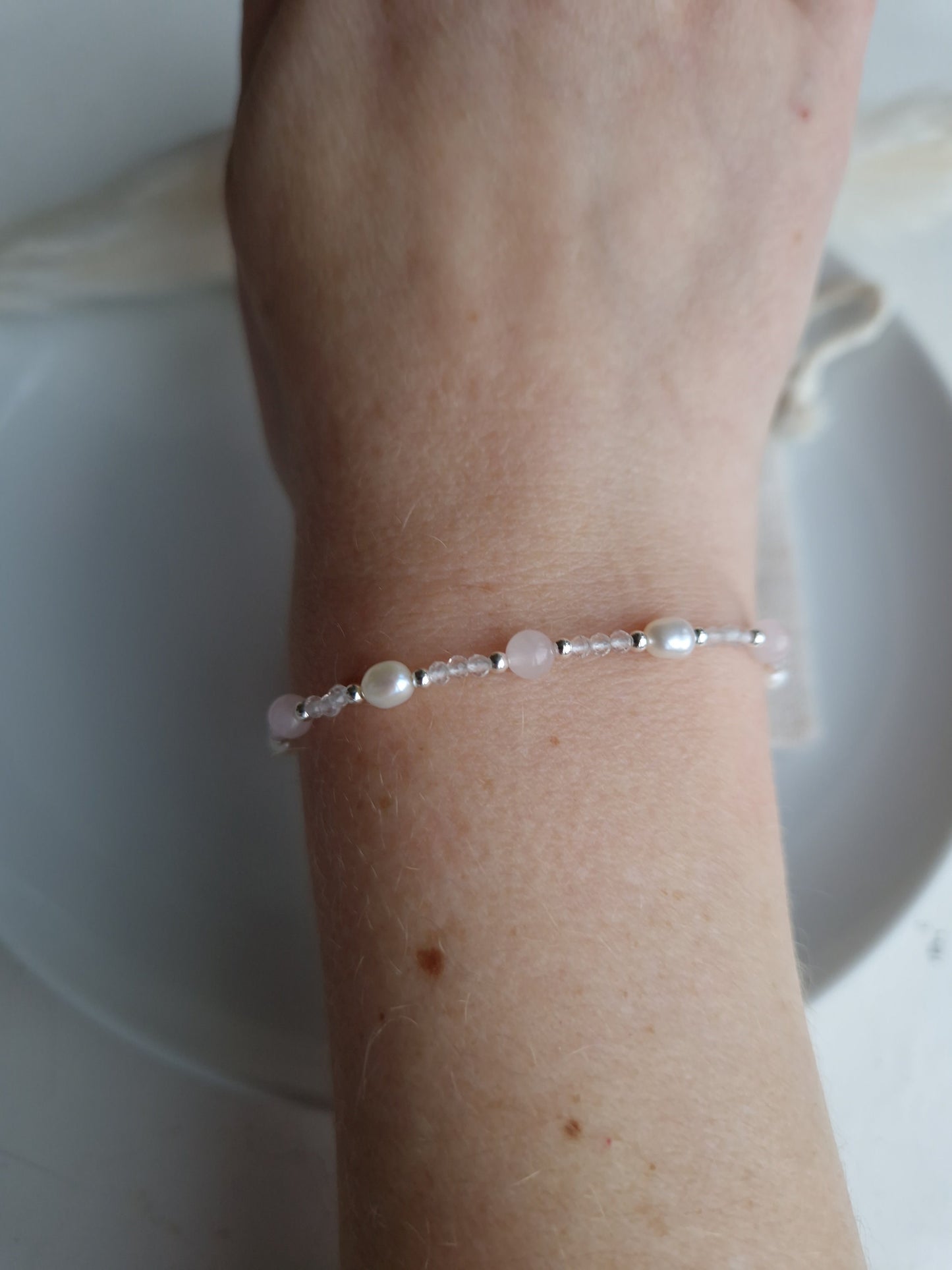 dainty bridesmaid bracelet with pearls and rose quartz and silver
