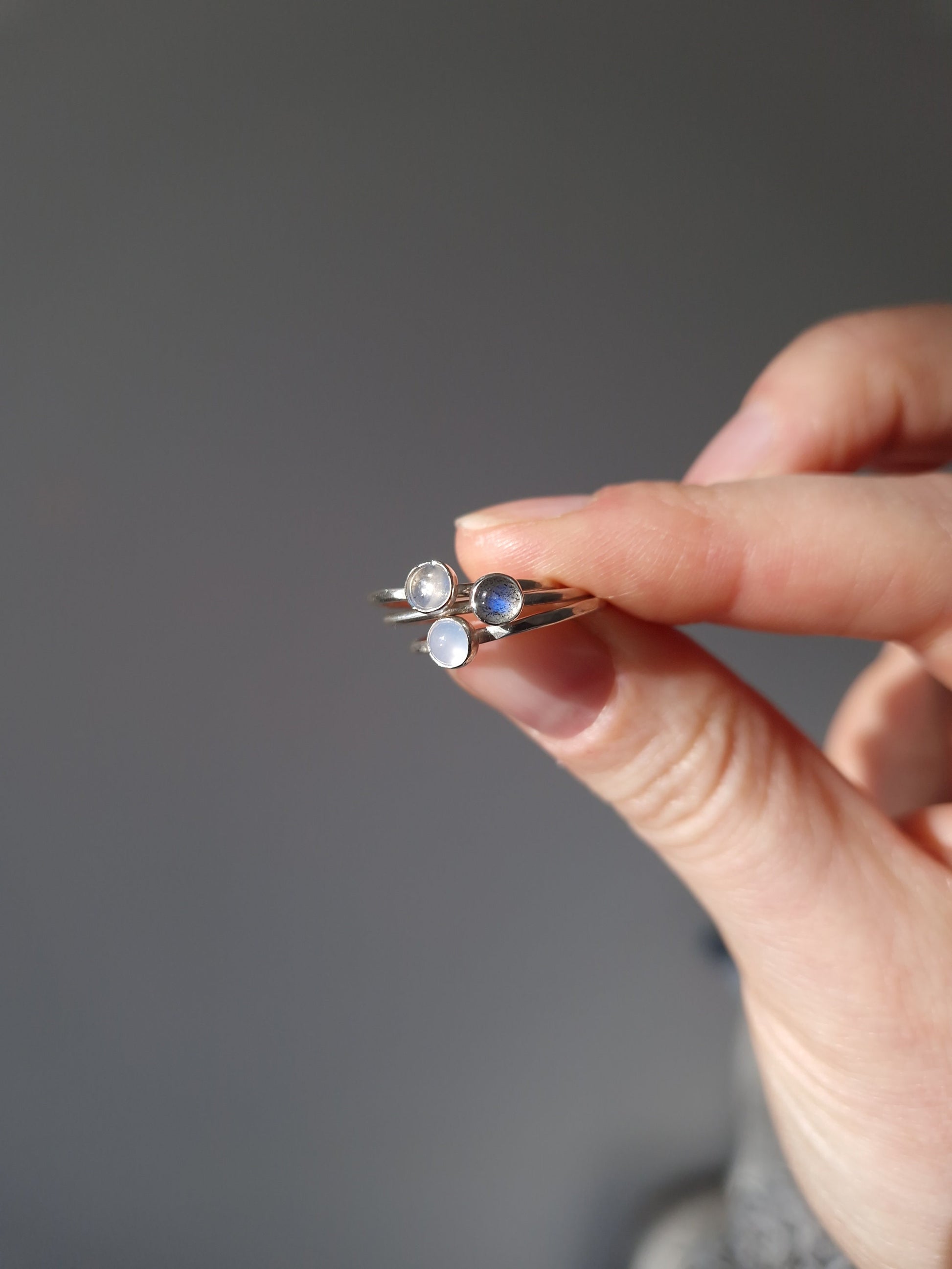 thin silver stacking rings with  small gemstones